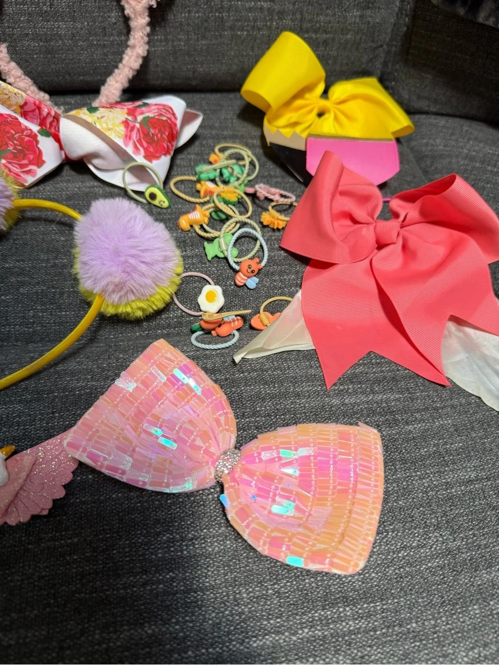 Bundle of girls hair accessories and a small little girls purse.